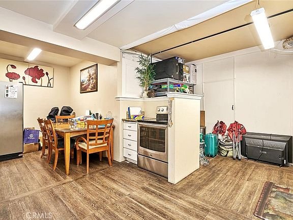 Modern dining area in California with wooden table and chairs